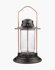Barebones Vintage-style Hurricane Lantern with clear seaded glass and bronze metal accents on a white background
