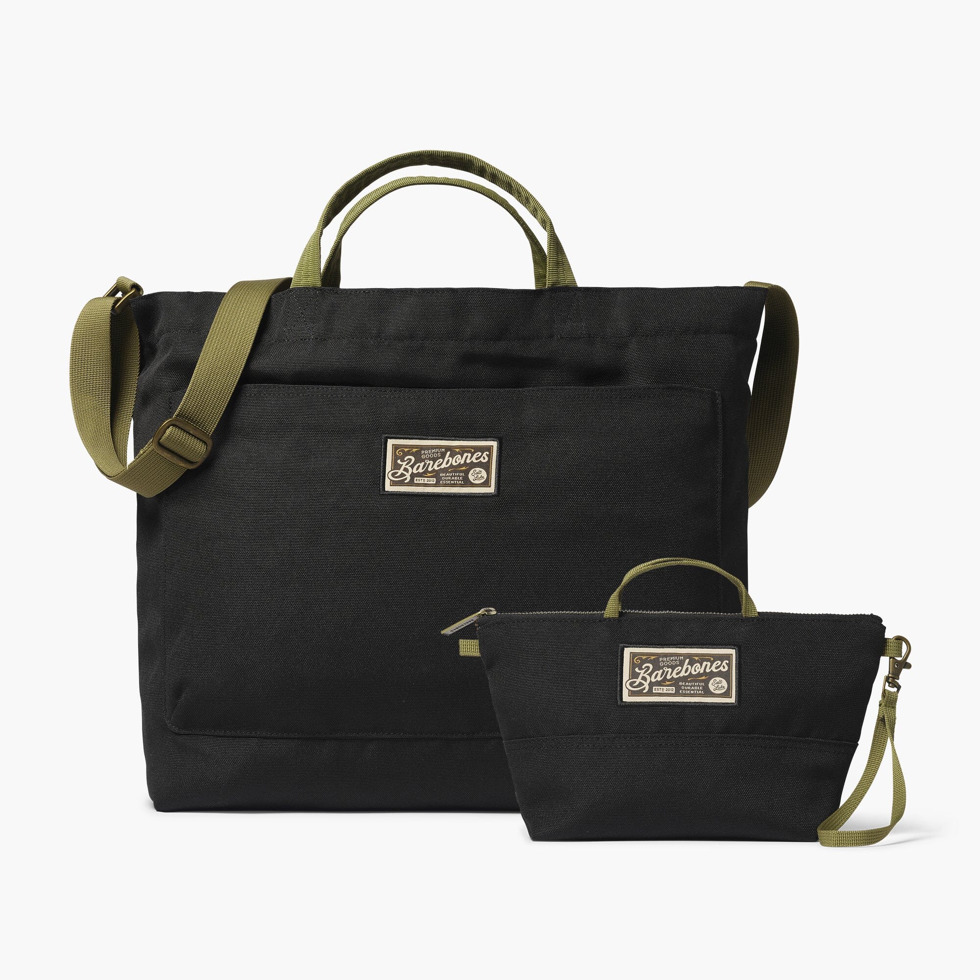 Barebones Modeer Work Tote and Zip Pouch Bundle. Black bags with green straps and on a white background.