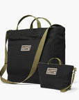 Barebones Modeer Work Tote and Zip Pouch Bundle. Black bags with green straps and on a white background.