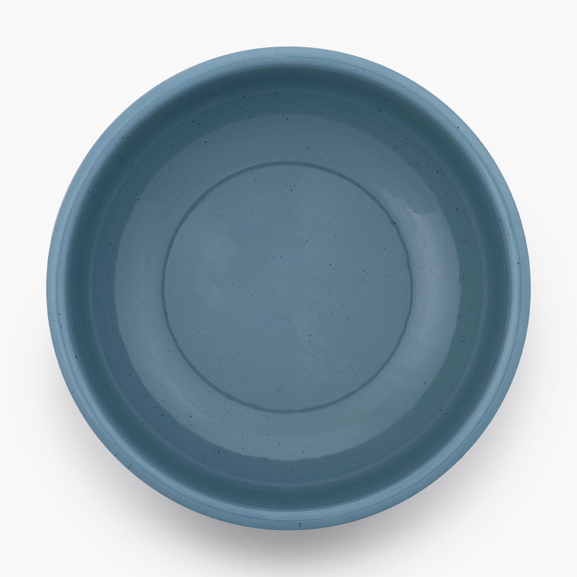 A smoky blue rolled enamel bowl on a white background