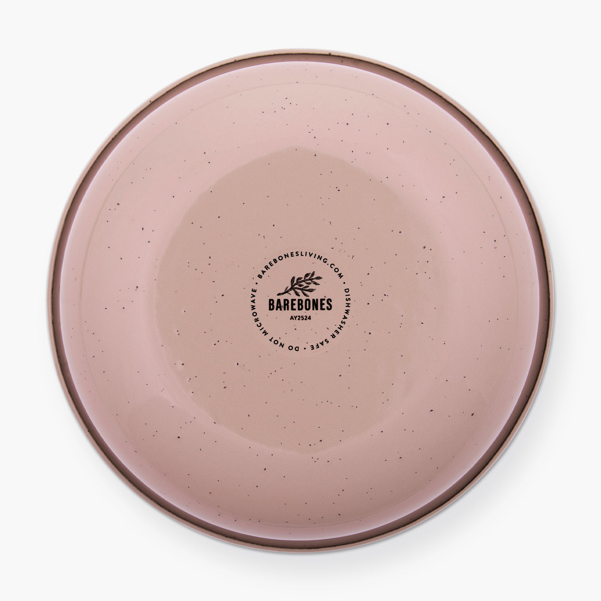 The bottom of a dusty rose rolled enamel bowl on a white background