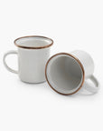 Two 5 oz speckled eggshell enamel espresso cups with copper plated rims on a white background.