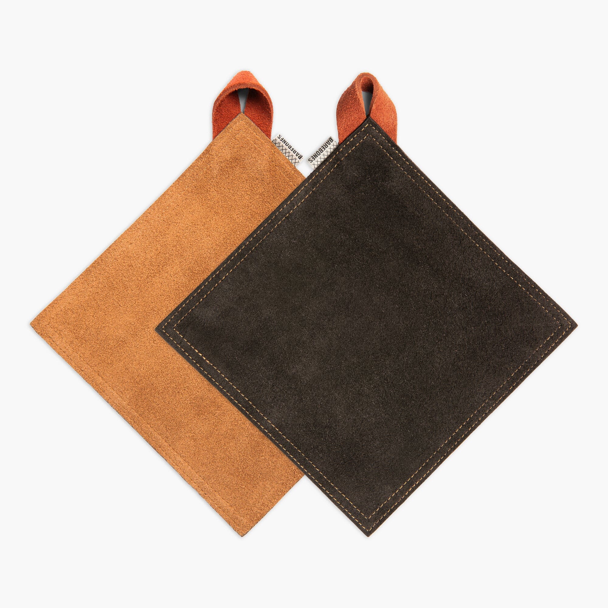 Two suede pot holders, one Tan and one Black, both with a Terracotta hanging strap, on a white background.