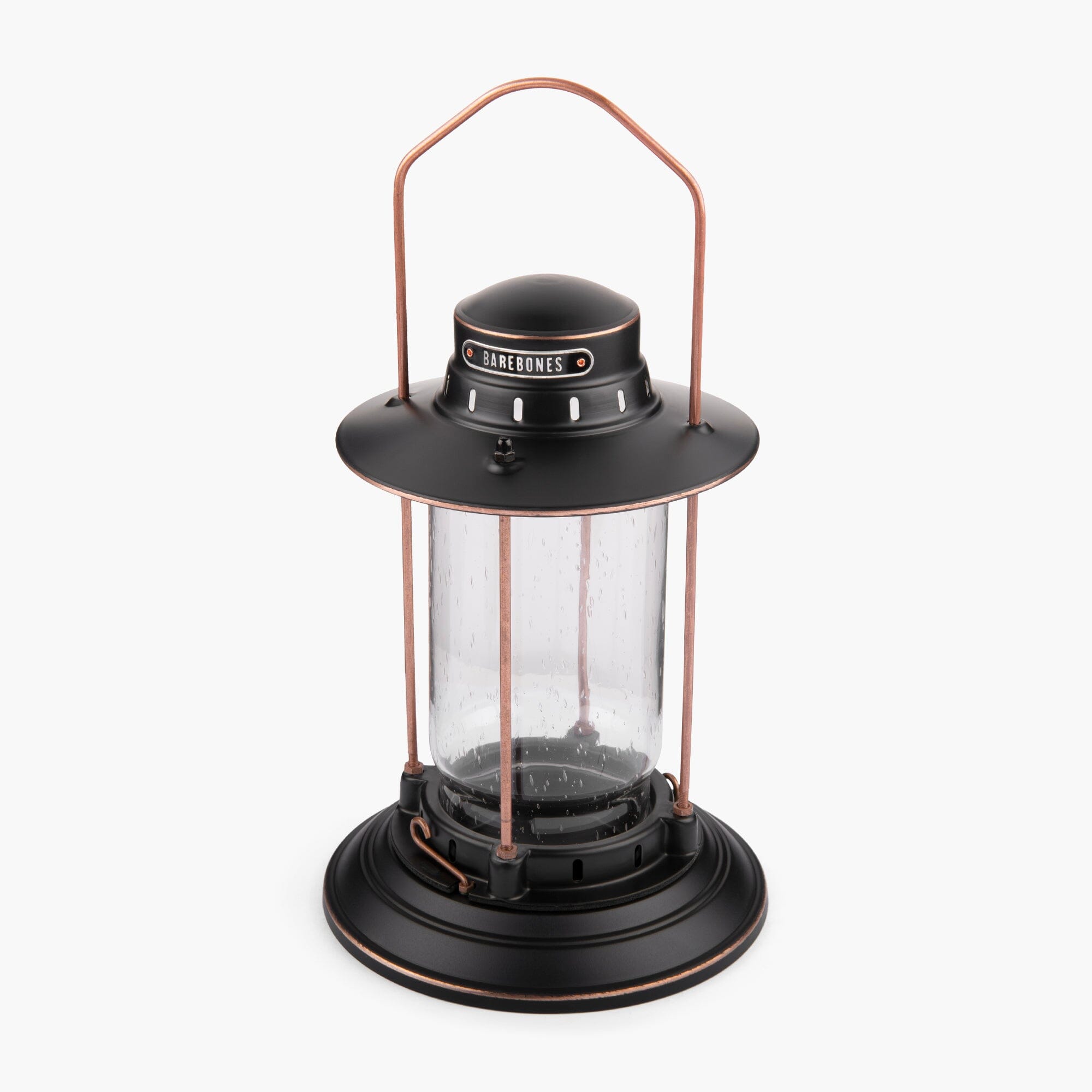 Barebones Vintage-style Hurricane Lantern with clear seaded glass and bronze metal accents on a white background