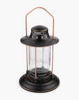 Barebones Vintage-style Hurricane Lantern with clear seaded glass and bronze metal accents on a white background